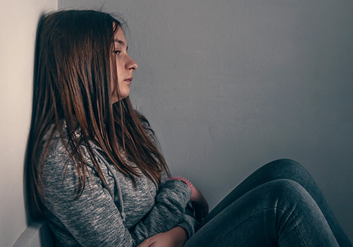 lonely teenager in corner