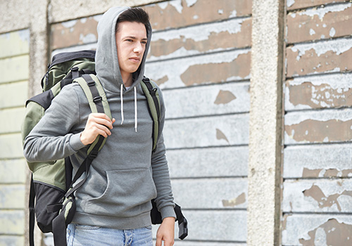 young man with backpack