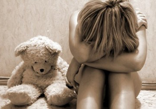 young girl with teddy bear