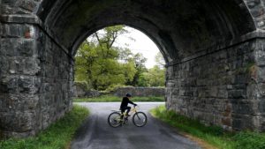 Child on bike fundraising for Childline