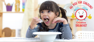 Young girl eats breakfast